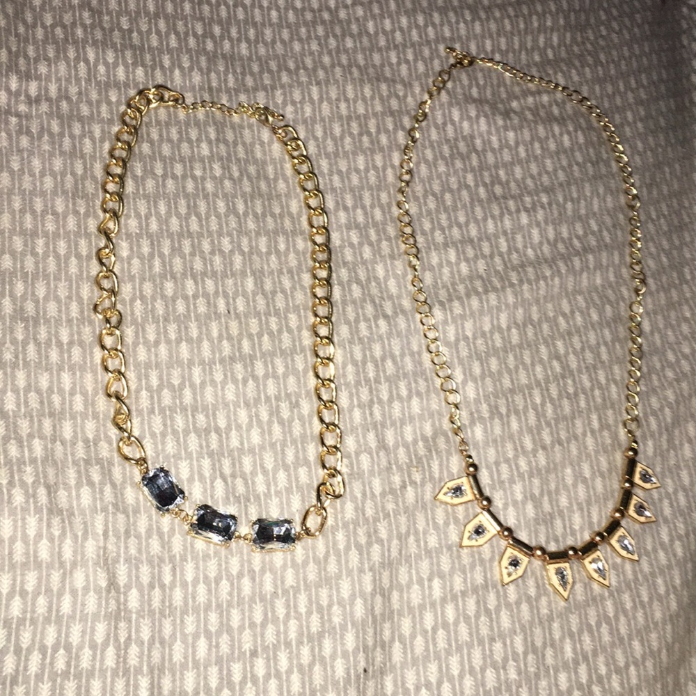 2 gold necklaces.